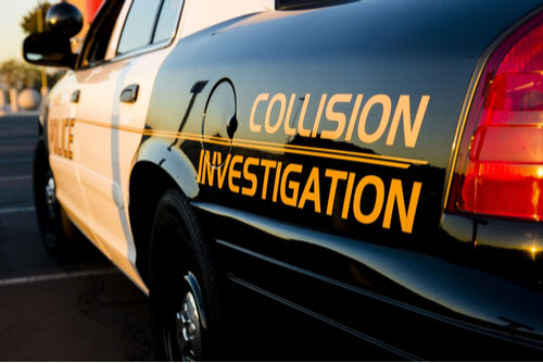 A police car with collision investigation painted on the side