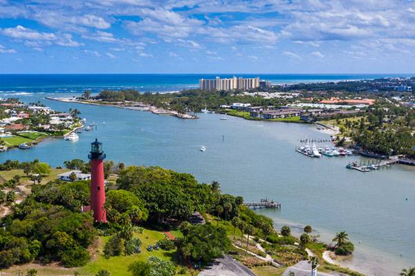 Lighthouse and boats on water in Jupiter Florida