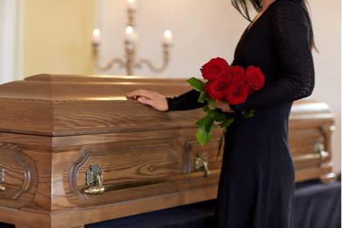 Woman at a funeral who needs a wrongful death attorney in Delray Beach