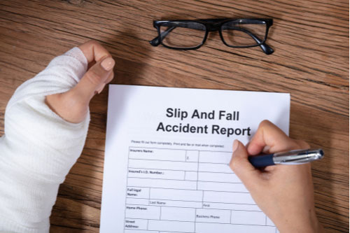 Delray Beach slip and fall accident victim filling out a report