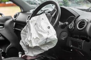 airbag after a crash, vehicle defects concept image
